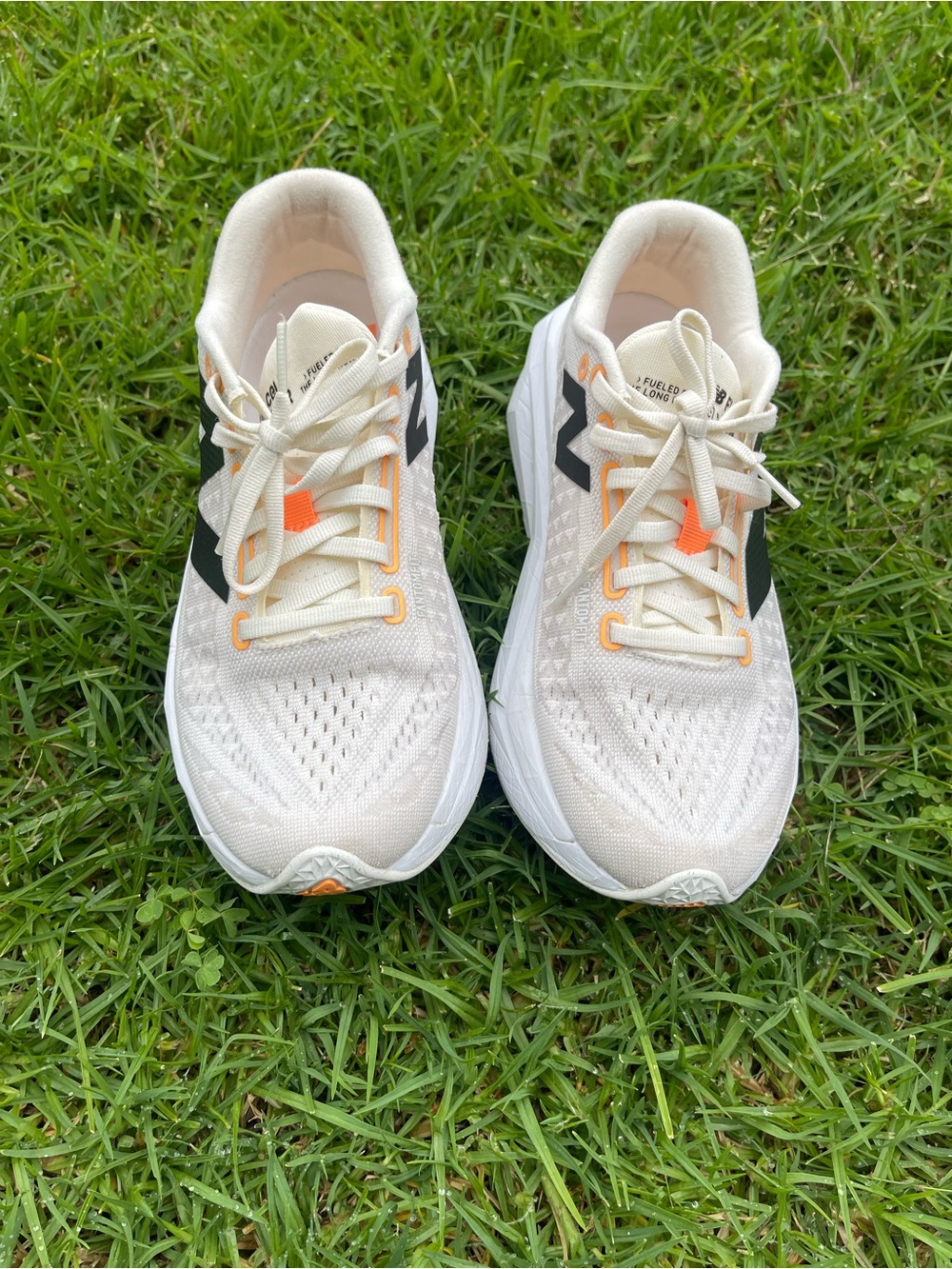 New Balance Cream Sneakers with Black Logo and Orange Accents